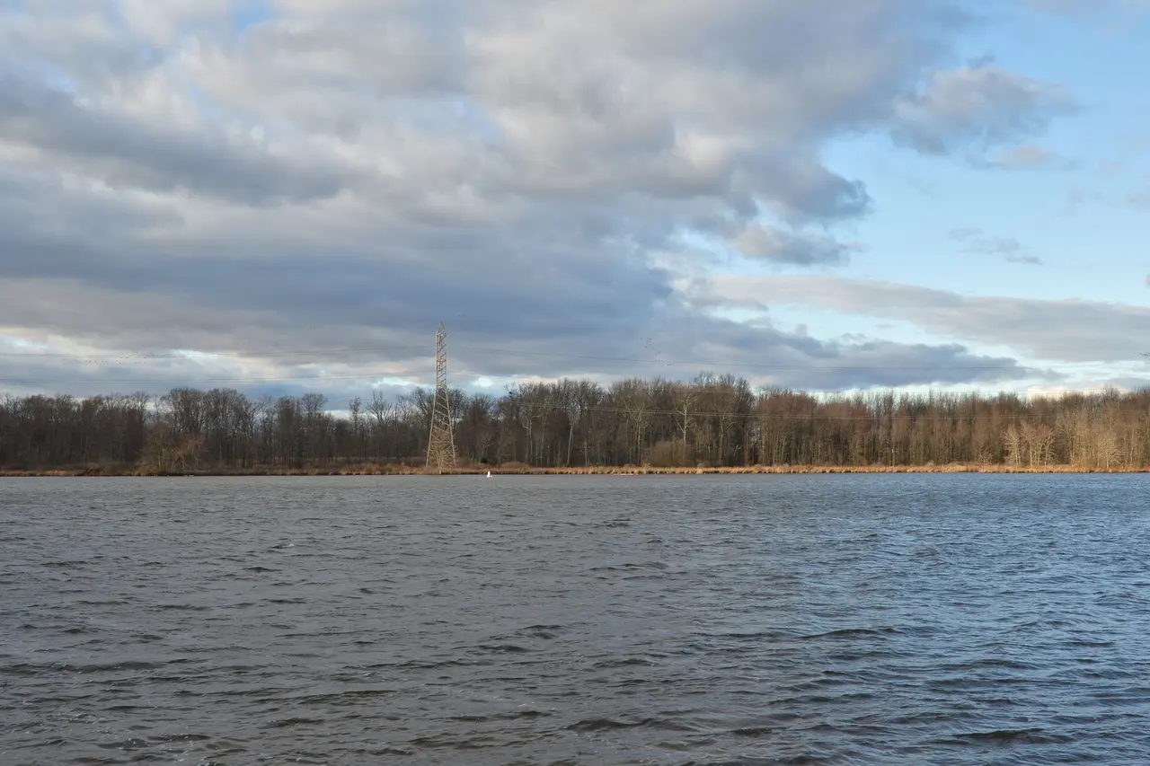 Mercer Lake in Mercer County Park under a cloudy sky, with bare trees on the far shore