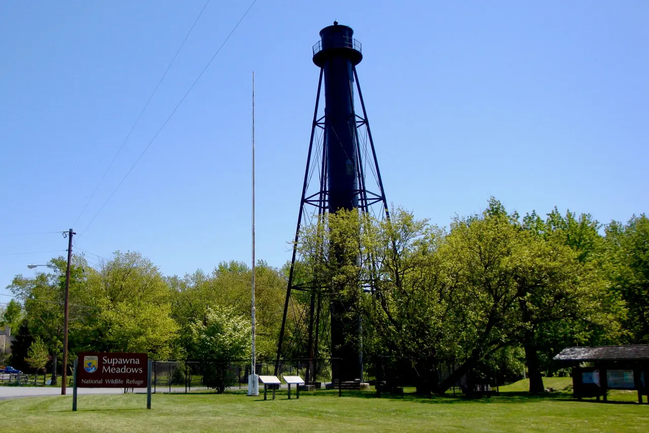 Finns Point Rear Range Light, a tall black iron lighthouse tower, at Supawna Meadows National Wildlife Refuge